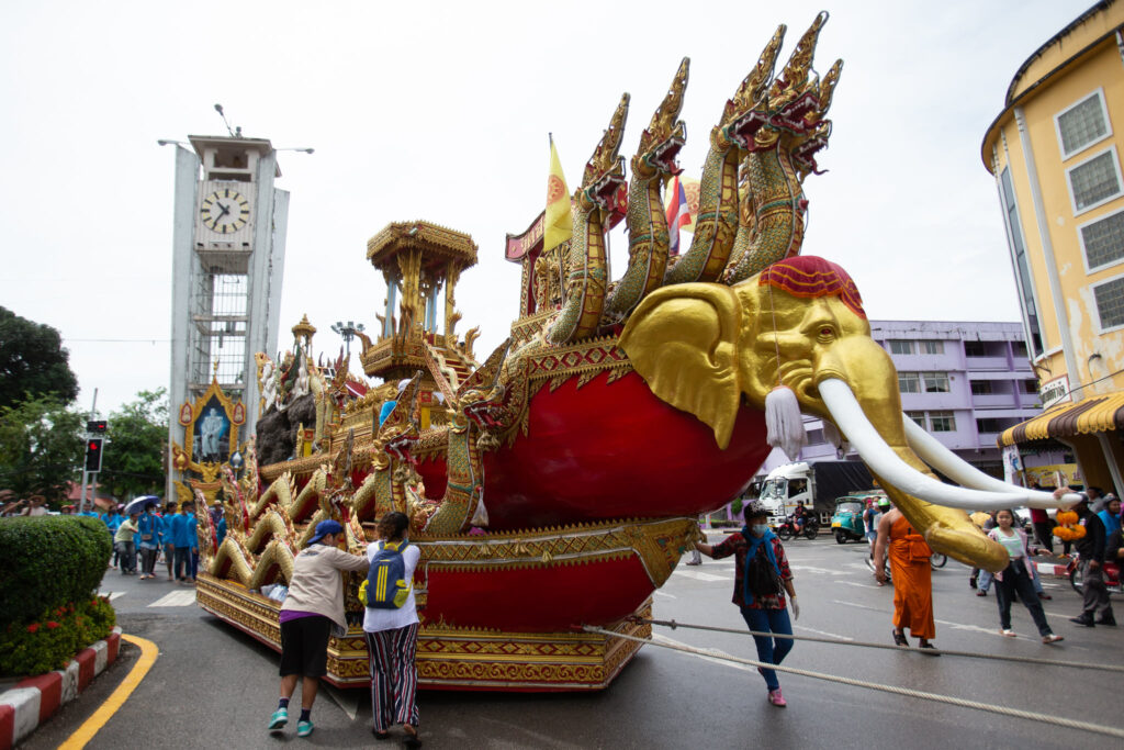 A decorative temple boat with elephant prow being paraded through Trang town as part of the Marine Pulling Buddha Procession.
