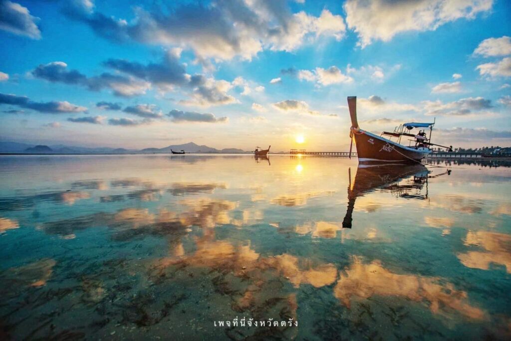 Sunrise over the pier of Ko Muk, a popular Trang 'living' island.
