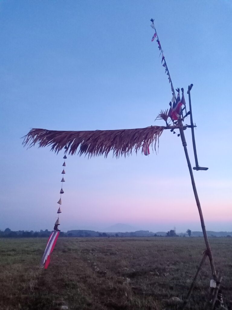 A traditional Na Muen Sri wind wheel of bamboo and palm leaf.